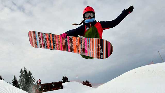 Maisie Potter on her snowboard